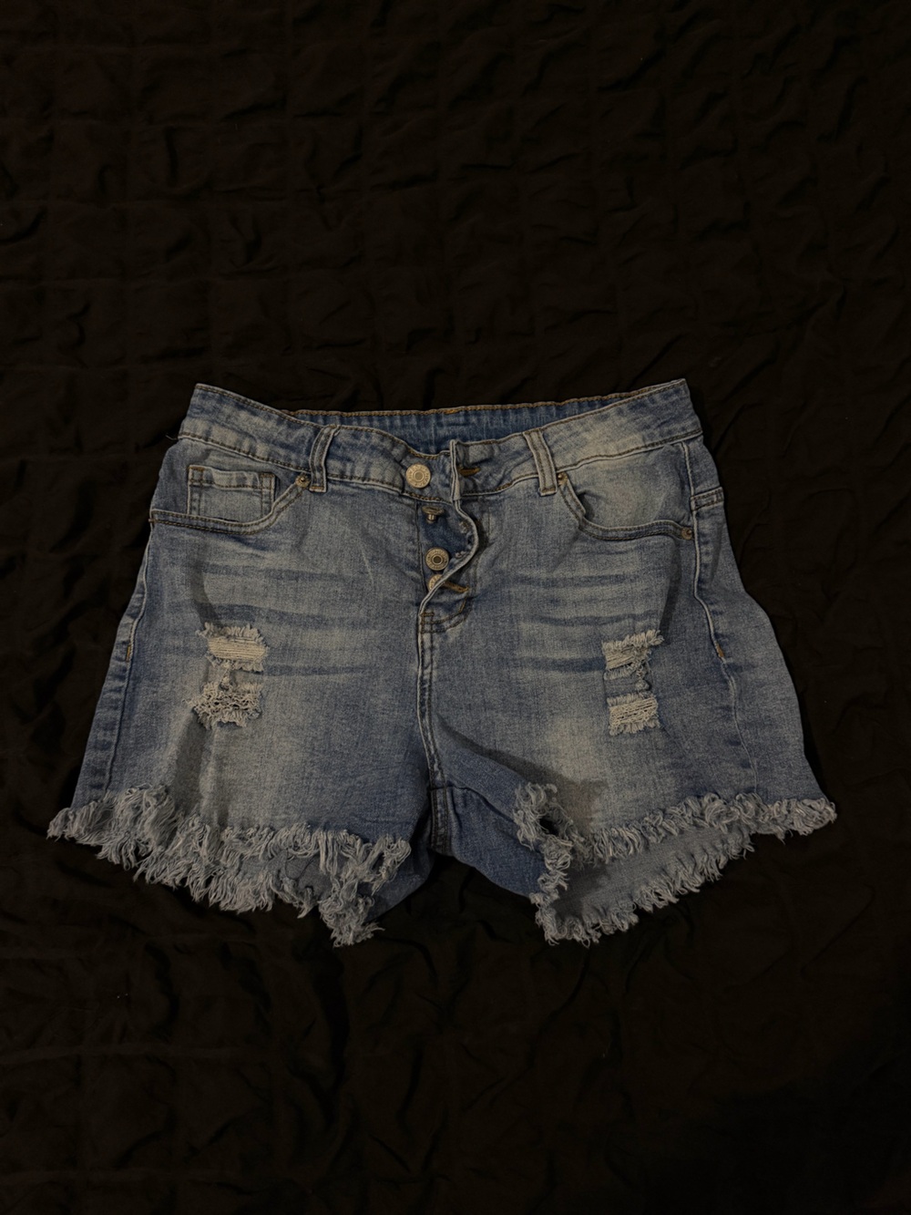 High-Rise Distressed Denim Shorts in Light Blue